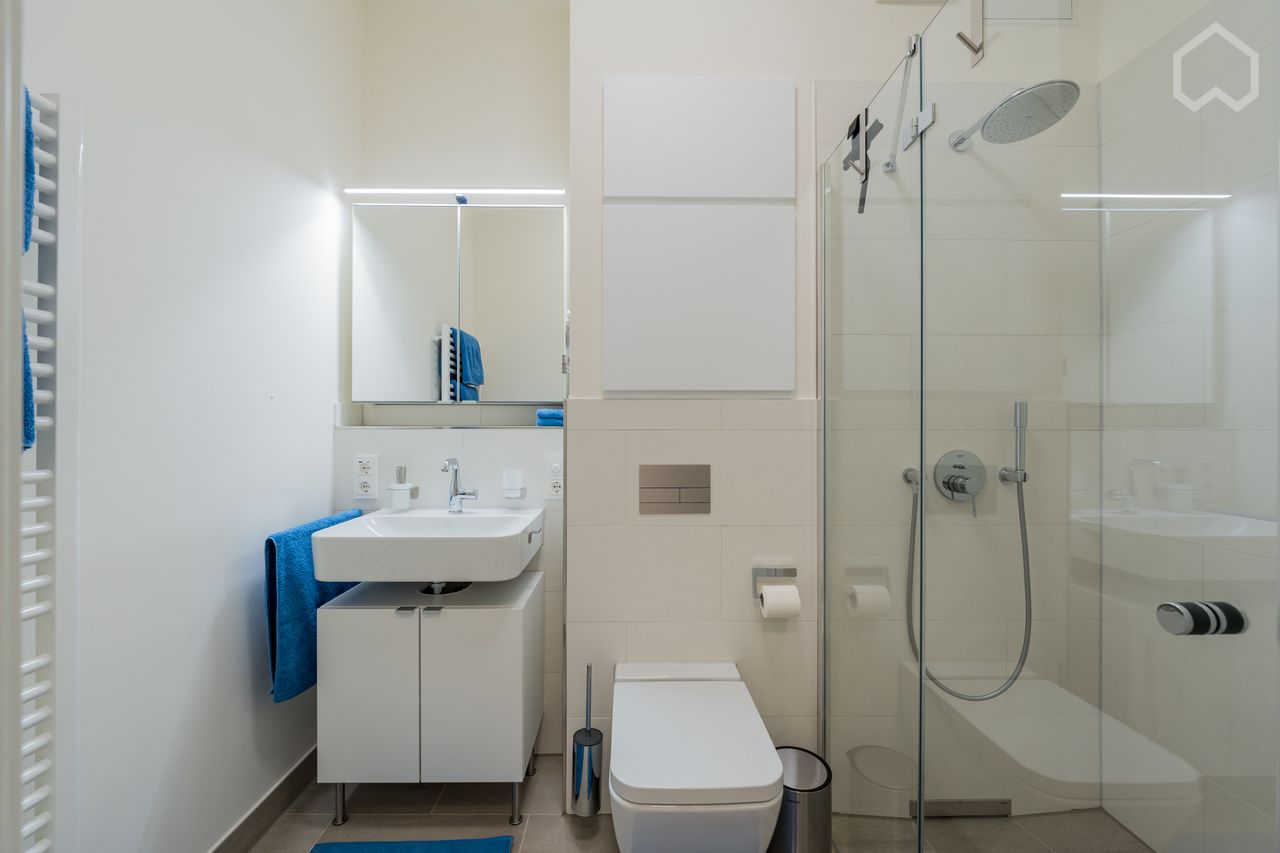 Luxurious living directly on the Spree: Modern 2-room apartment in Berlin Charlottenburg with partially covered terrace and spacious garden