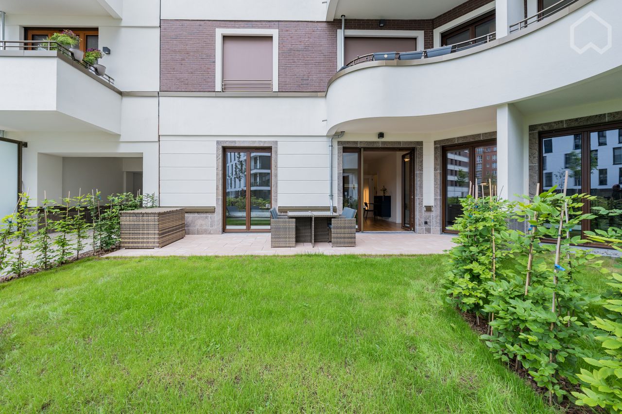 Luxurious living directly on the Spree: Modern 2-room apartment in Berlin Charlottenburg with partially covered terrace and spacious garden