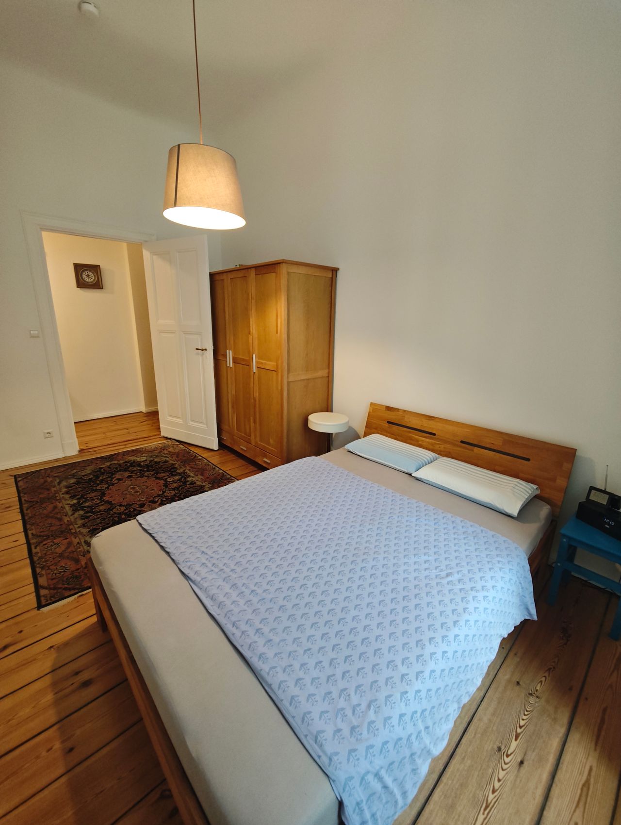 Stylish classic 2-room flat with wooden floors, chandelier & balcony