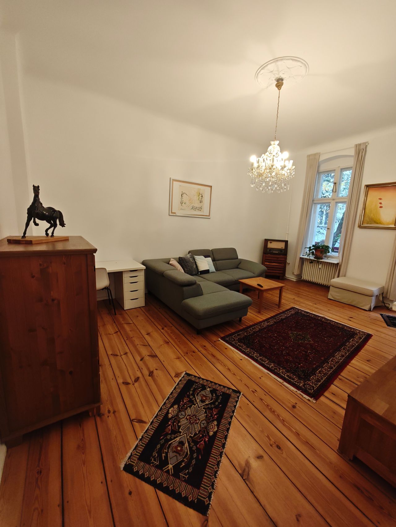 Stylish classic 2-room flat with wooden floors, chandelier & balcony